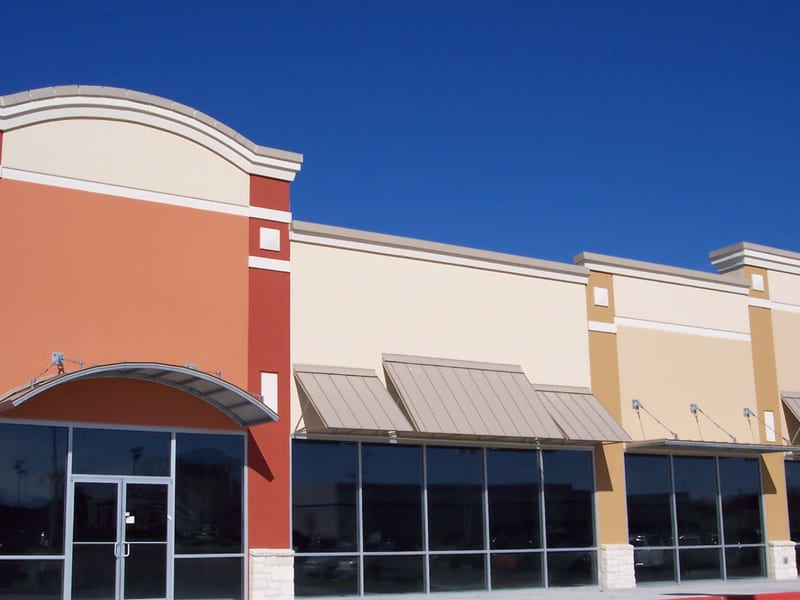 Commercial storefront windows along a building exterior